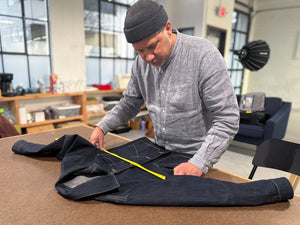 Steven measuring a coat
