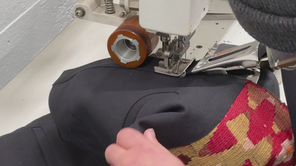 Steven adding a waistband to a Kilim jacket